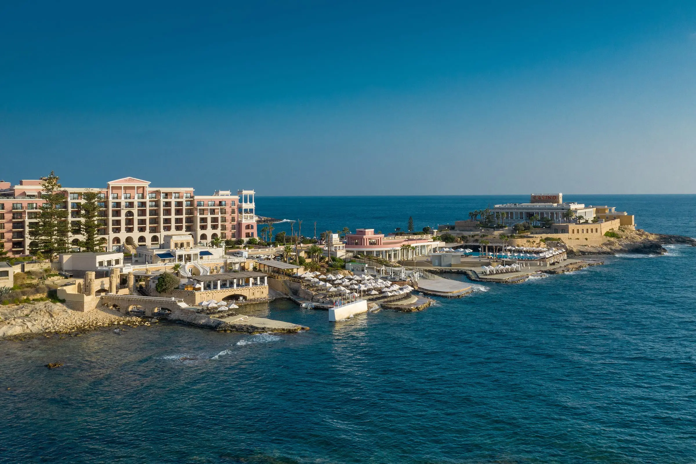 The Westin Dragonara Resort on Dragonara Point, with its lido, sea pools and the Dragonara Palace