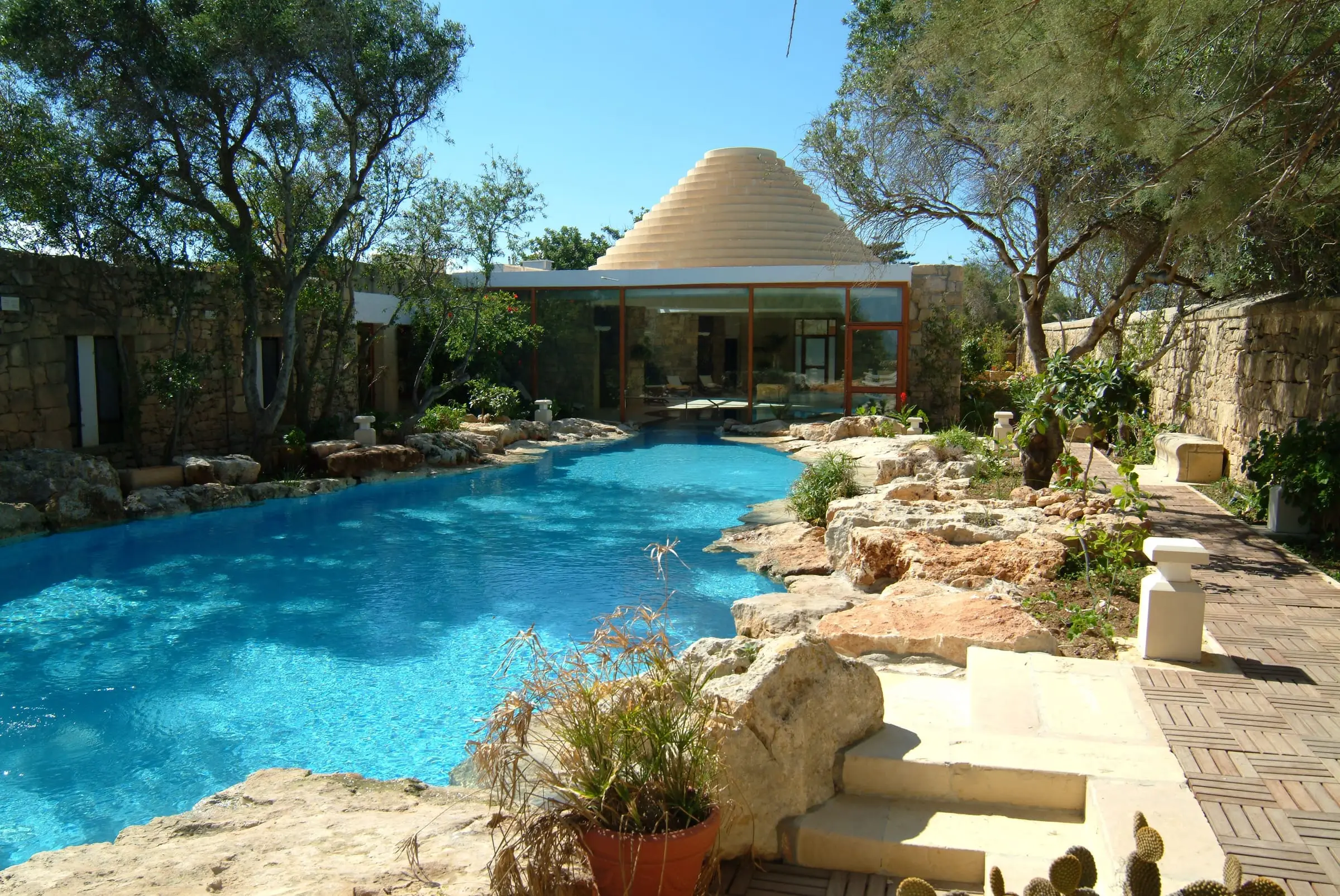 The pool at Ta’ Ċenċ among the gardens and rocks