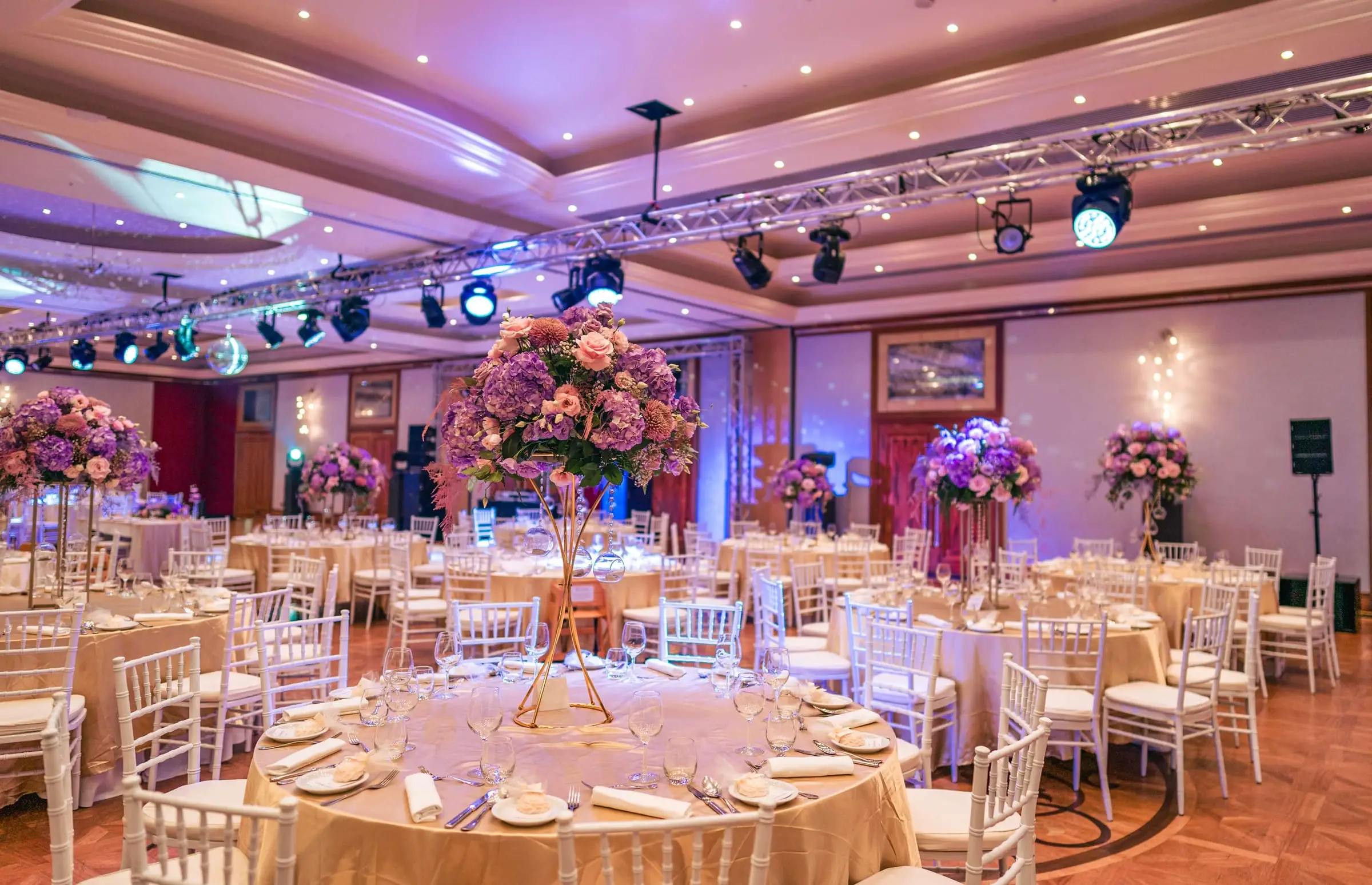 The ballroom at the Radisson Blu Golden Sands set for a gala dinner, with stage lighting