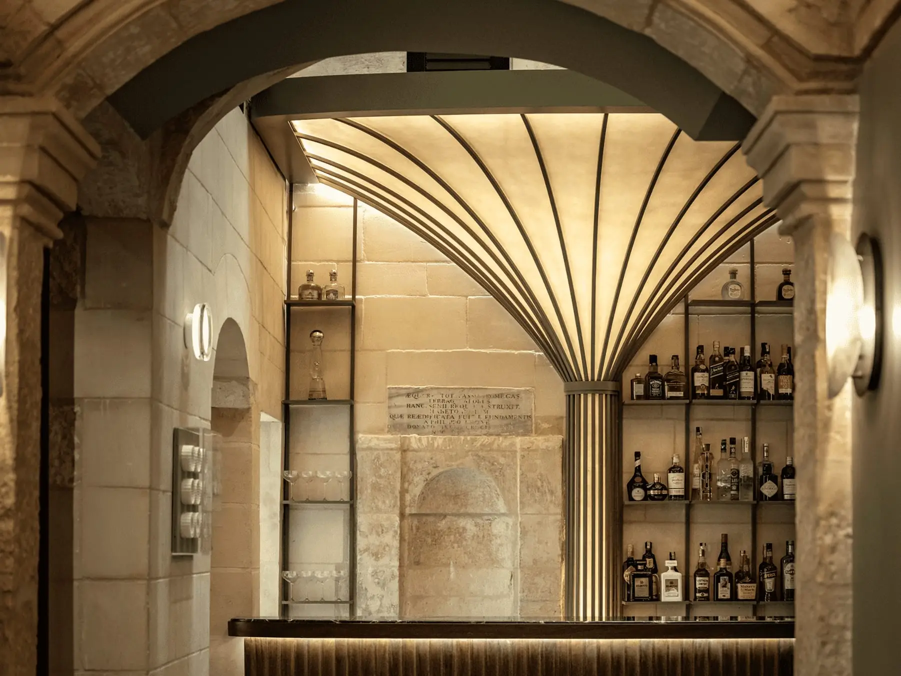 The bar, set under a stone arch
