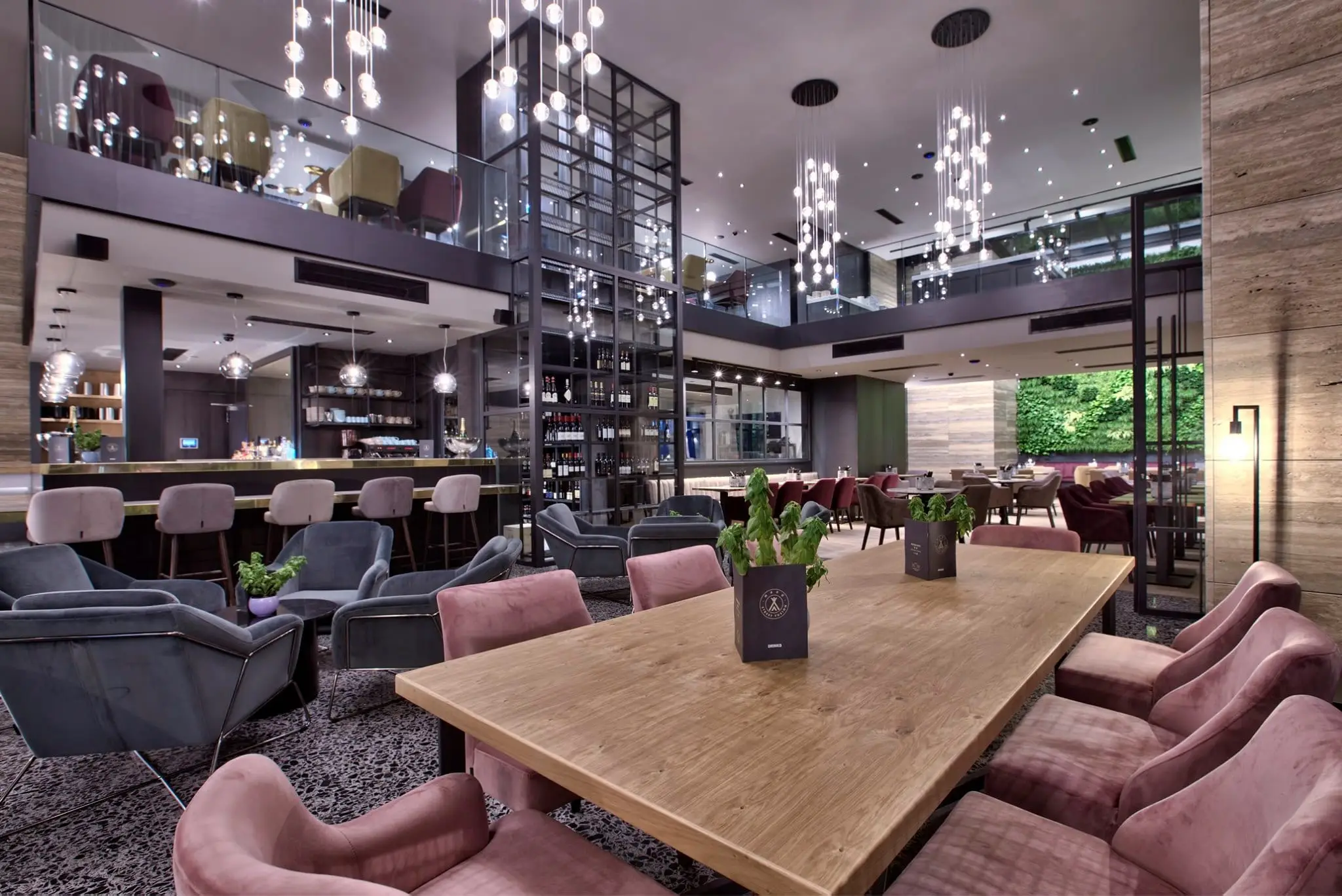 The lobby bar and dining area at Number 11, under hanging glass lights