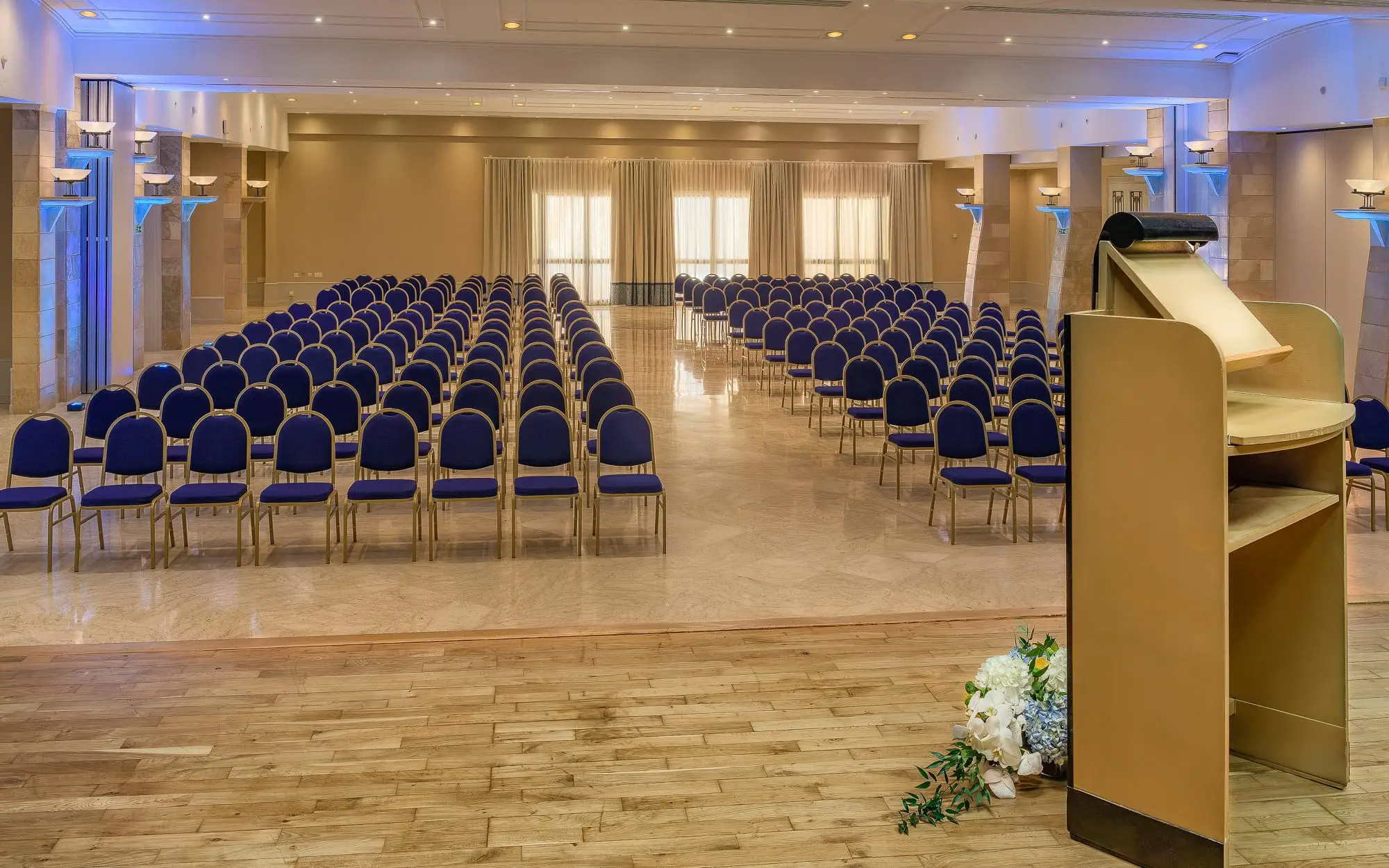 A function room set theatre-style with a lectern at the front