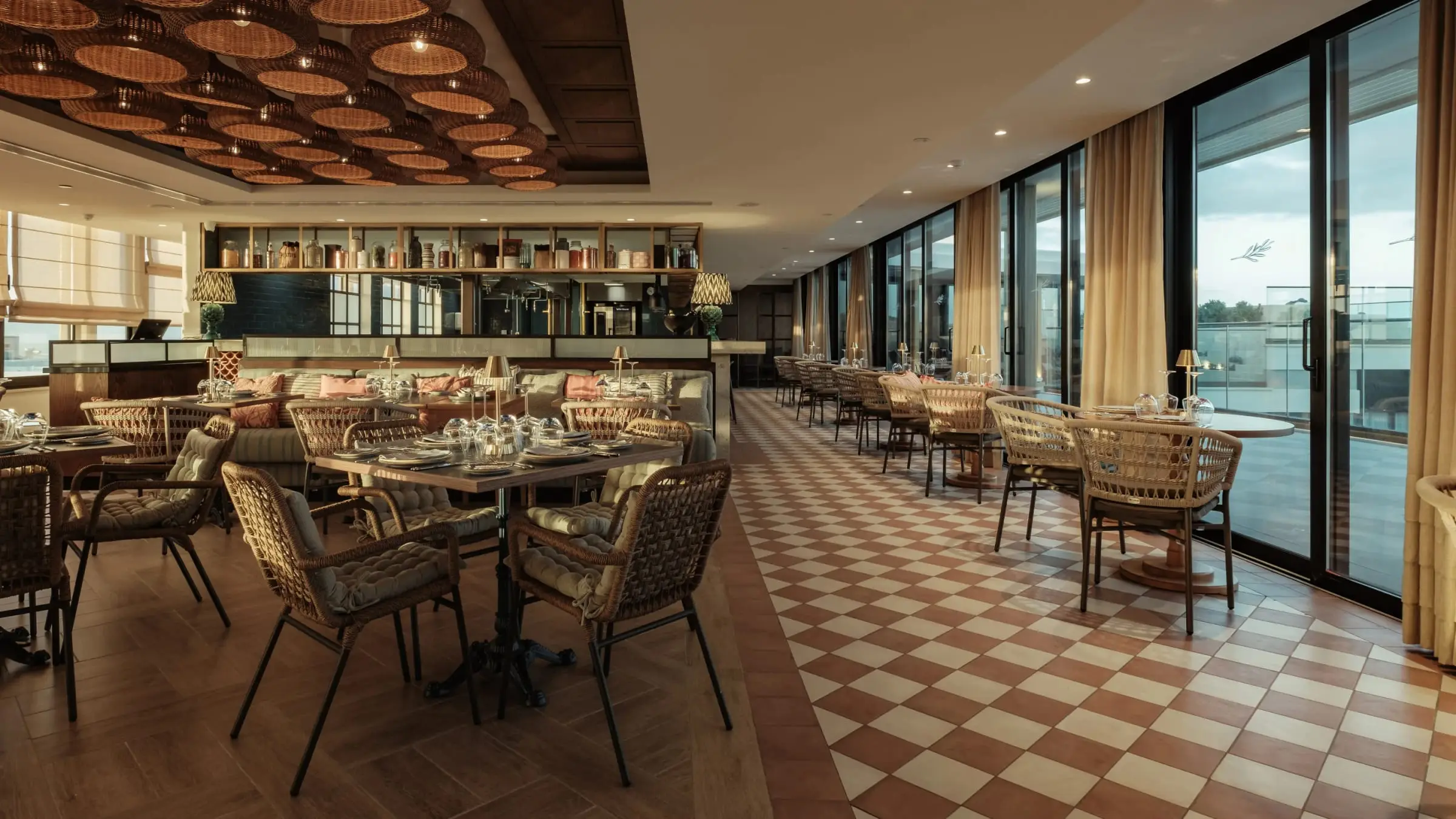 The Minoa restaurant, its tables along the windows