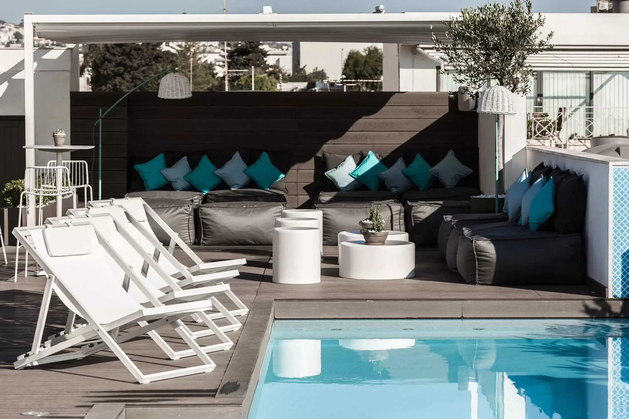 The rooftop pool and lounge terrace at Hotel Juliani