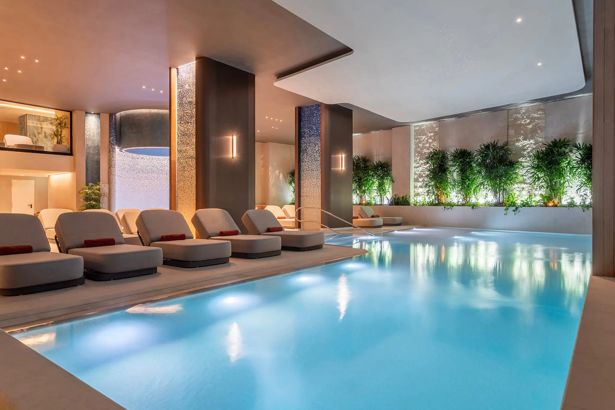 The indoor pool at the Rock Spa, loungers along the water
