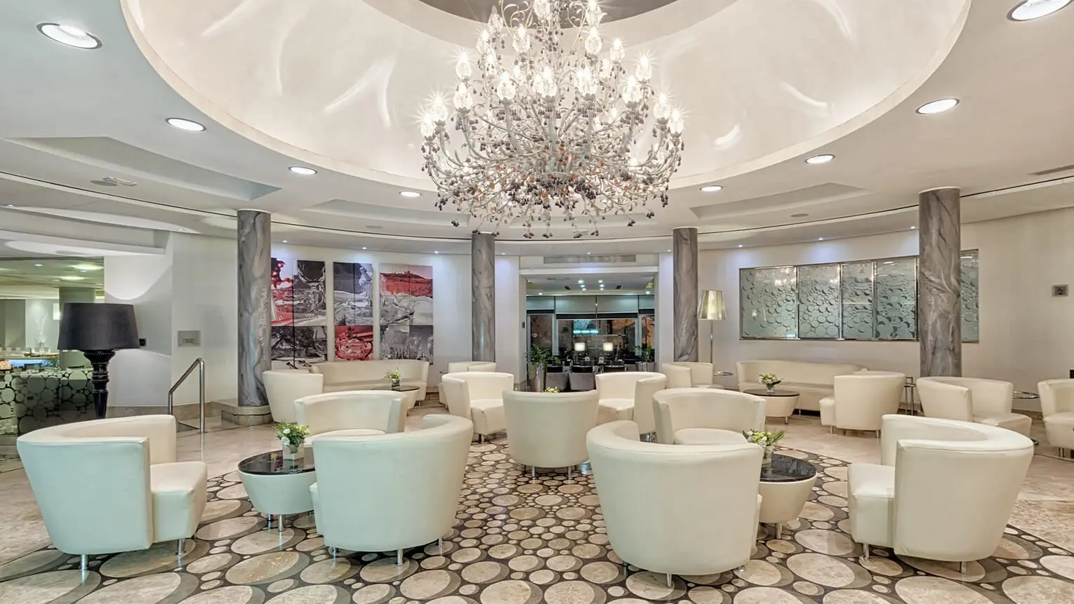 The lobby lounge at AX The Palace, under a crystal chandelier