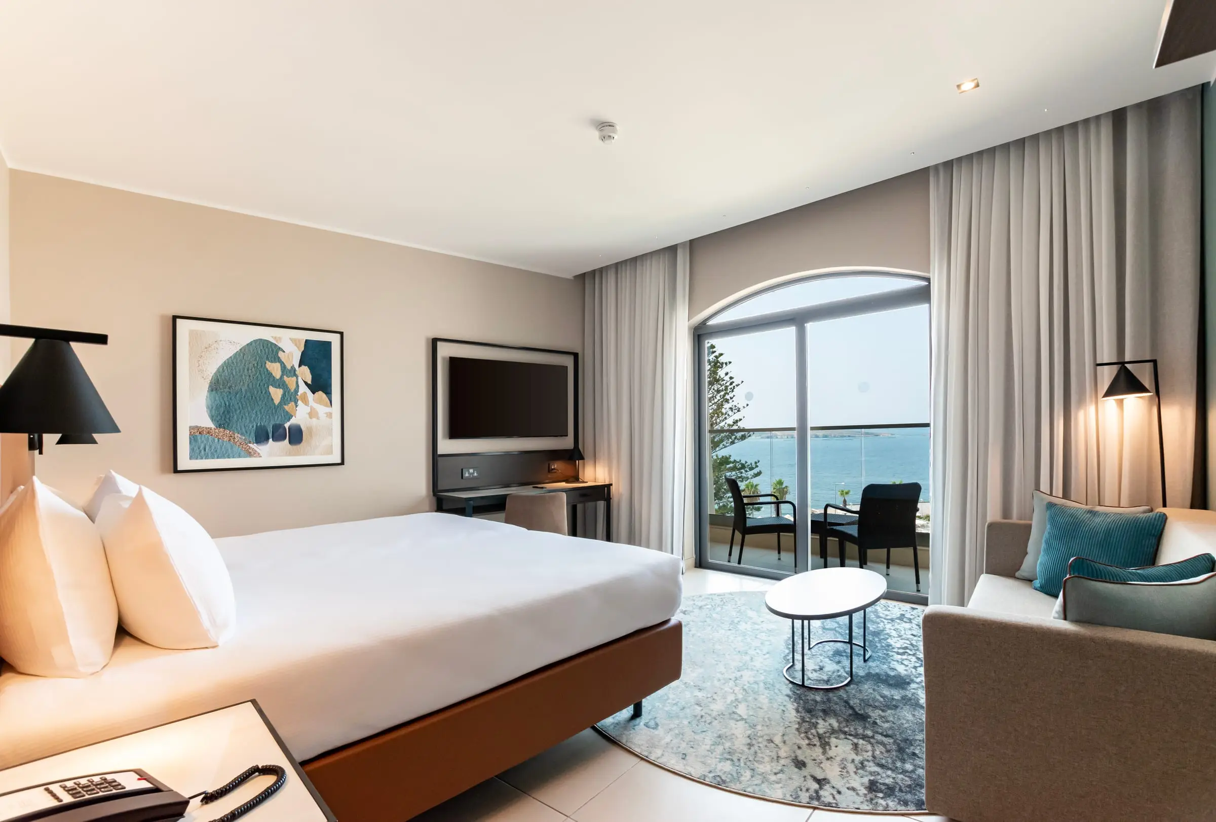 A sea-view room at DoubleTree by Hilton Malta, with a balcony