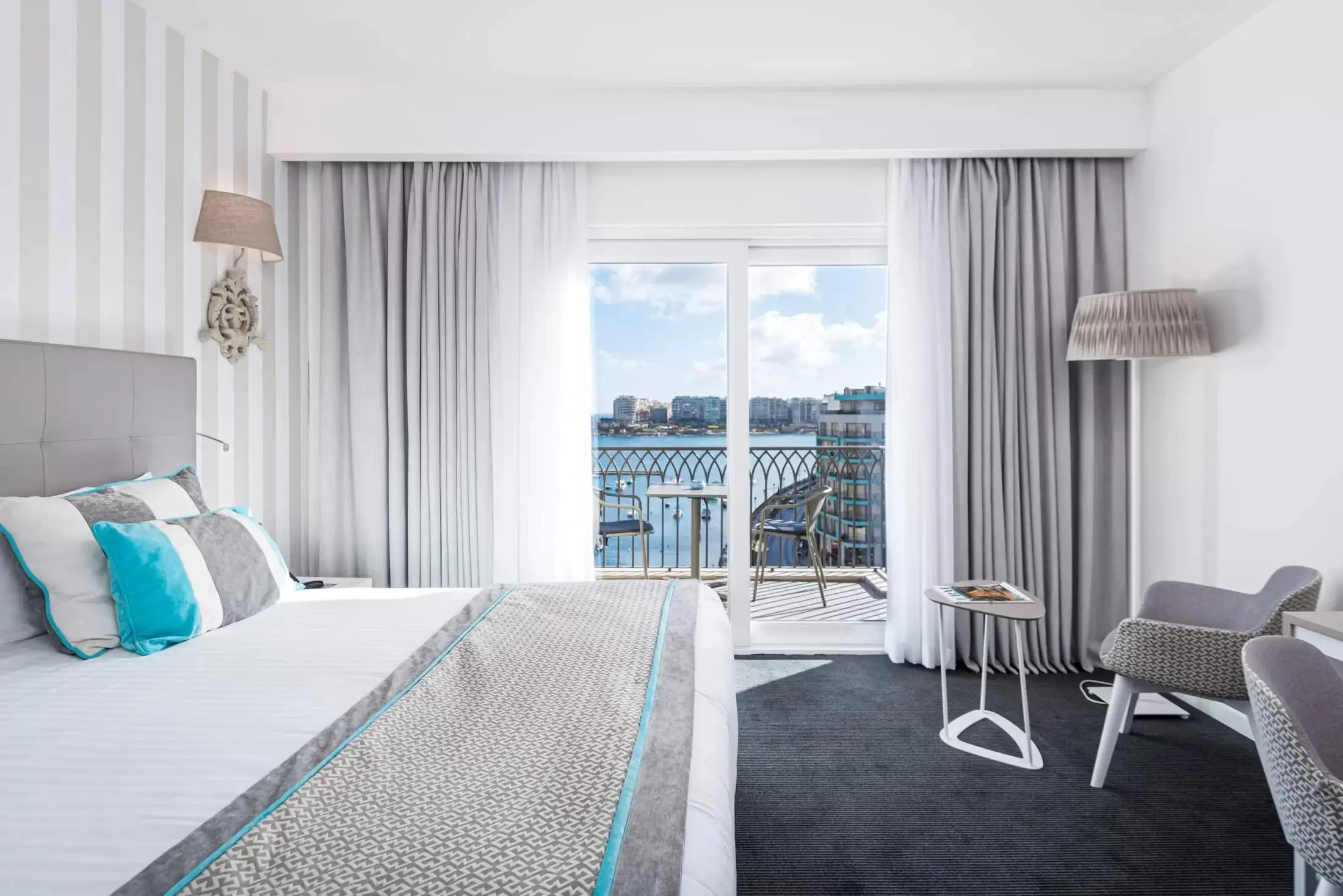 A room at Hotel Juliani with a balcony over Spinola Bay