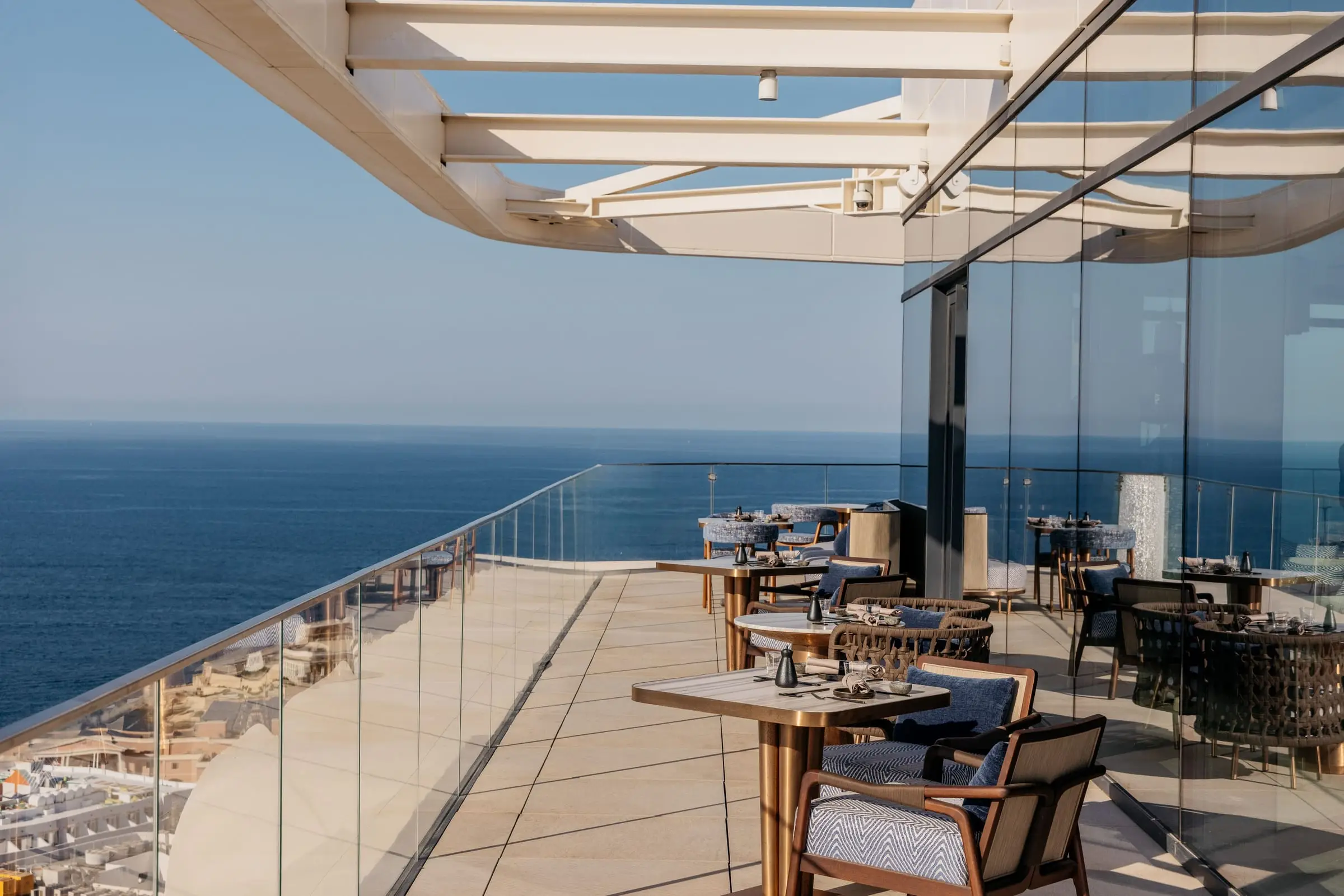 A rooftop terrace bar over the sea