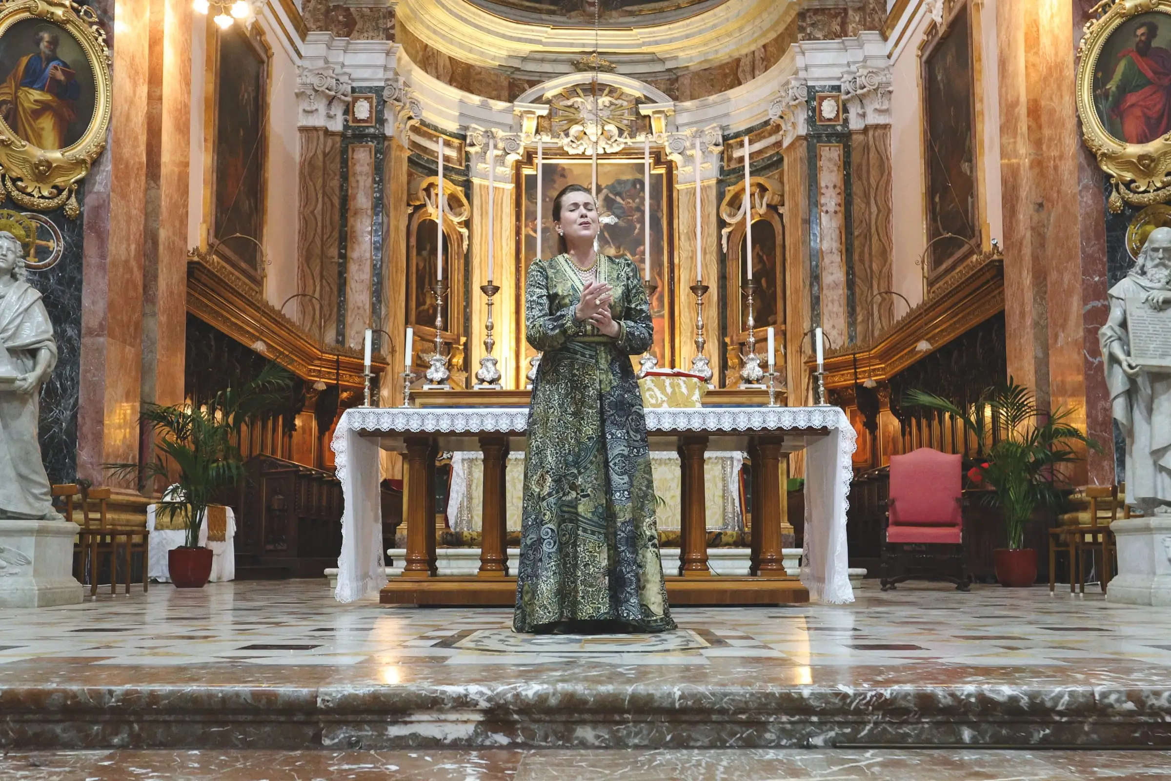 A soprano sings before the high altar of St Paul’s Cathedral in Mdina, opened after hours for one group