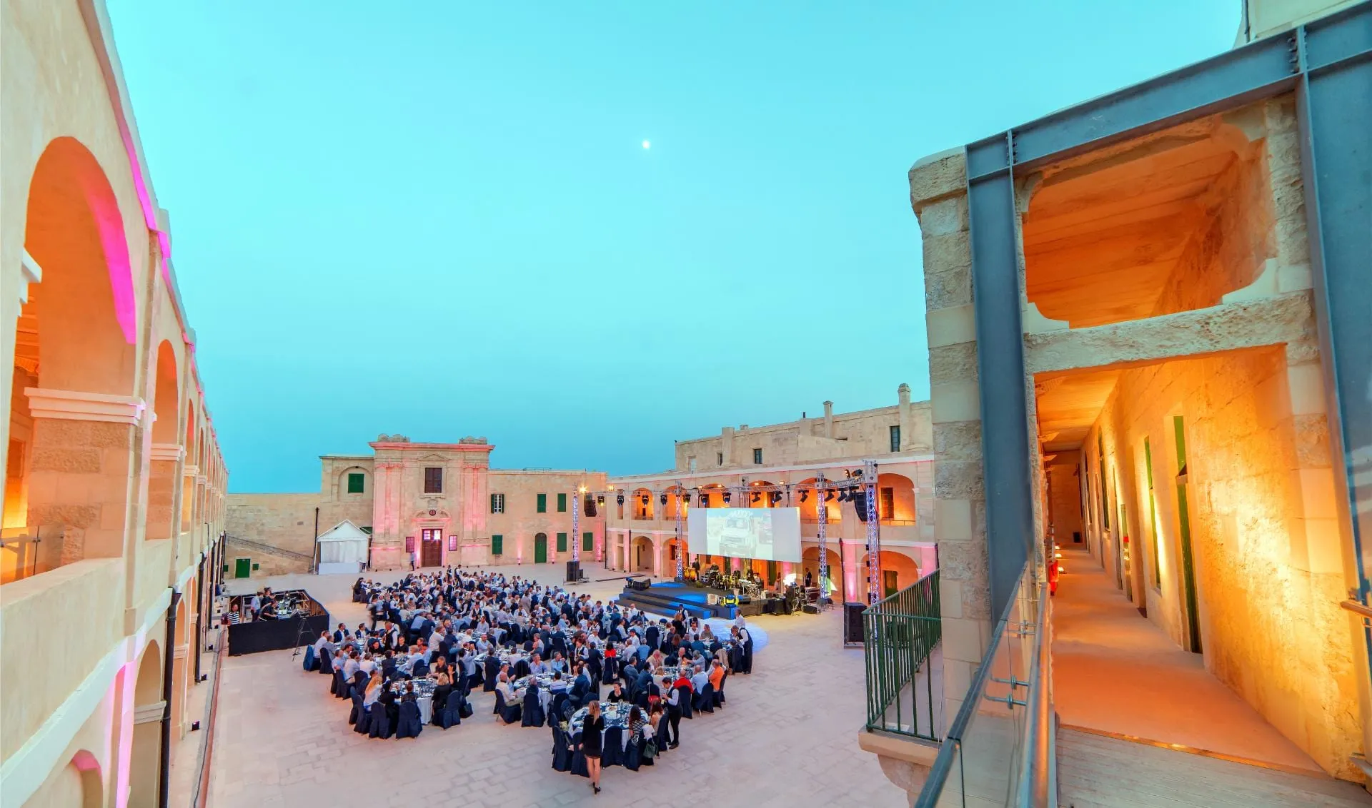 A gala dinner staged in the parade ground of Fort St Elmo at dusk