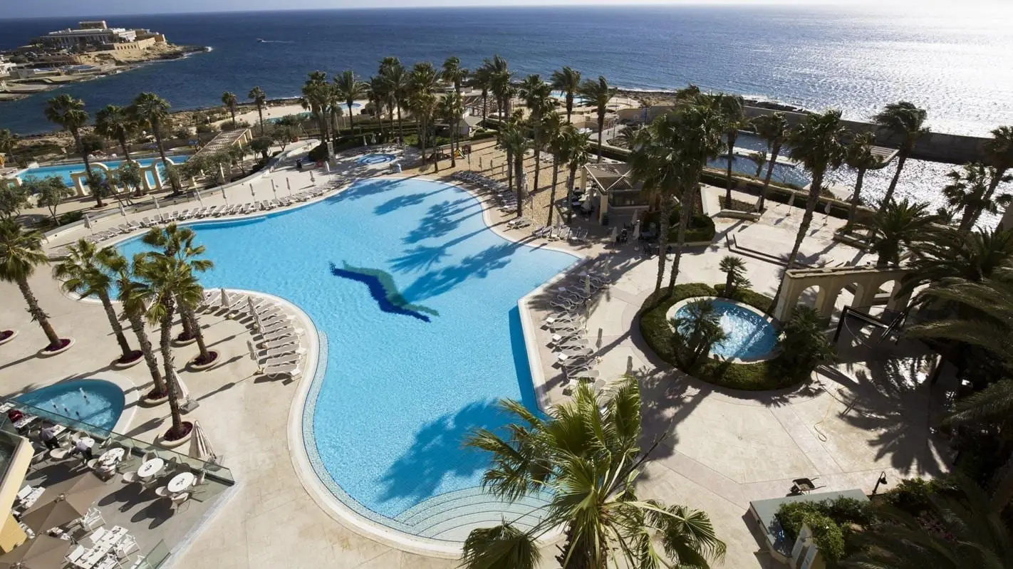 The Hilton Malta at Portomaso from the air, its pools and the marina beside it