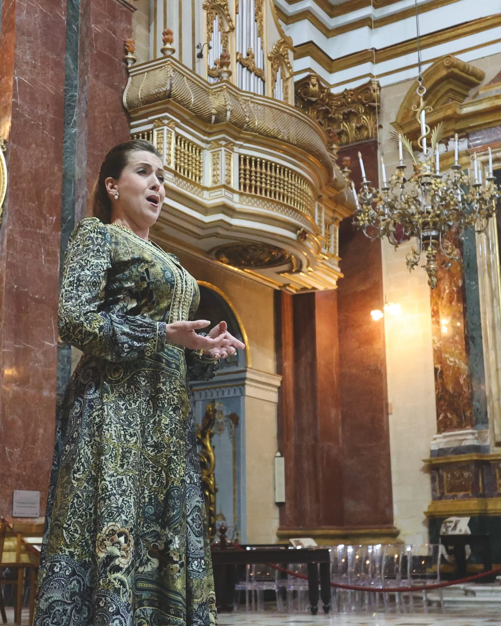 A soprano performing inside a cathedral opened after hours