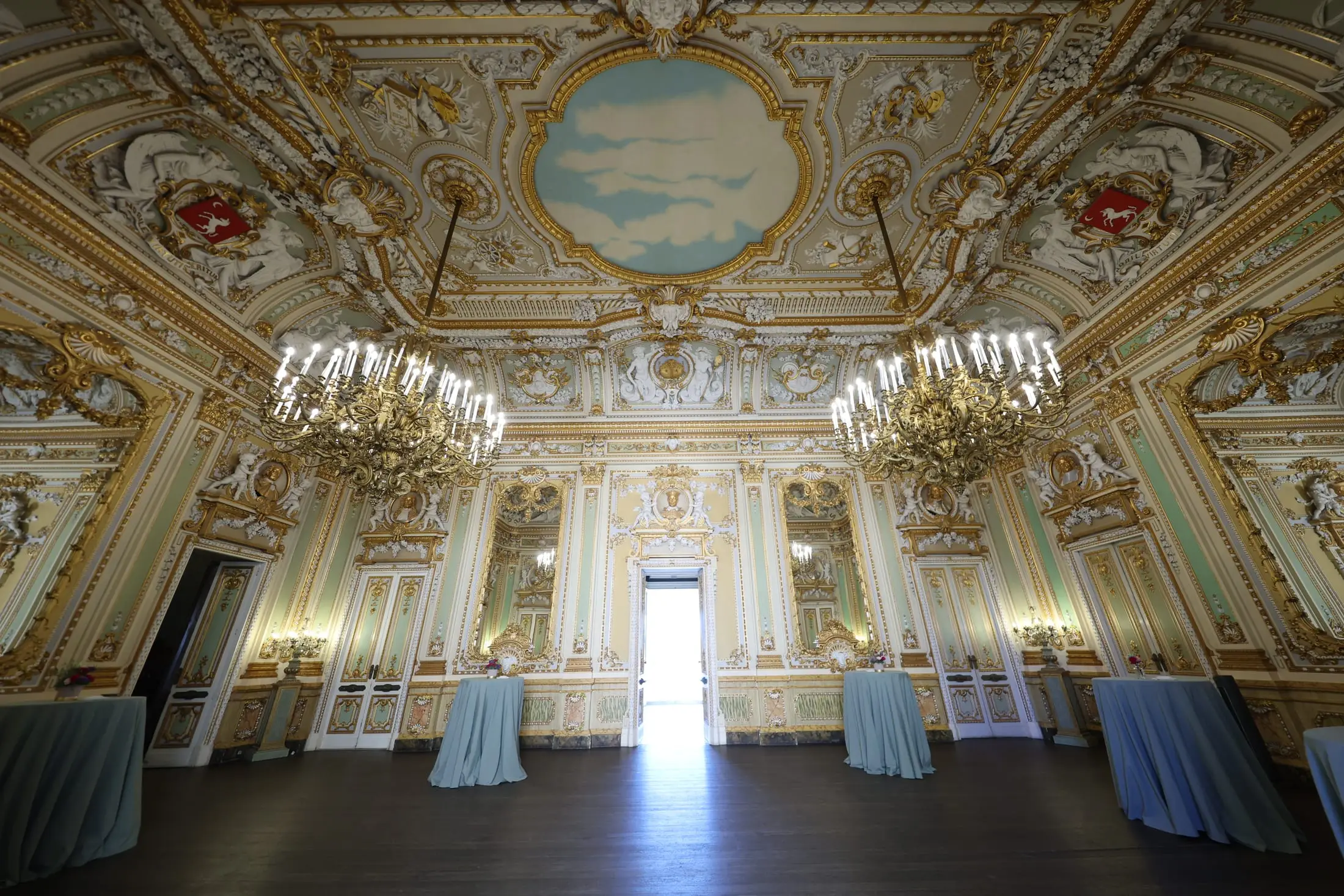 The gilded state rooms of Palazzo Parisio, set for a reception