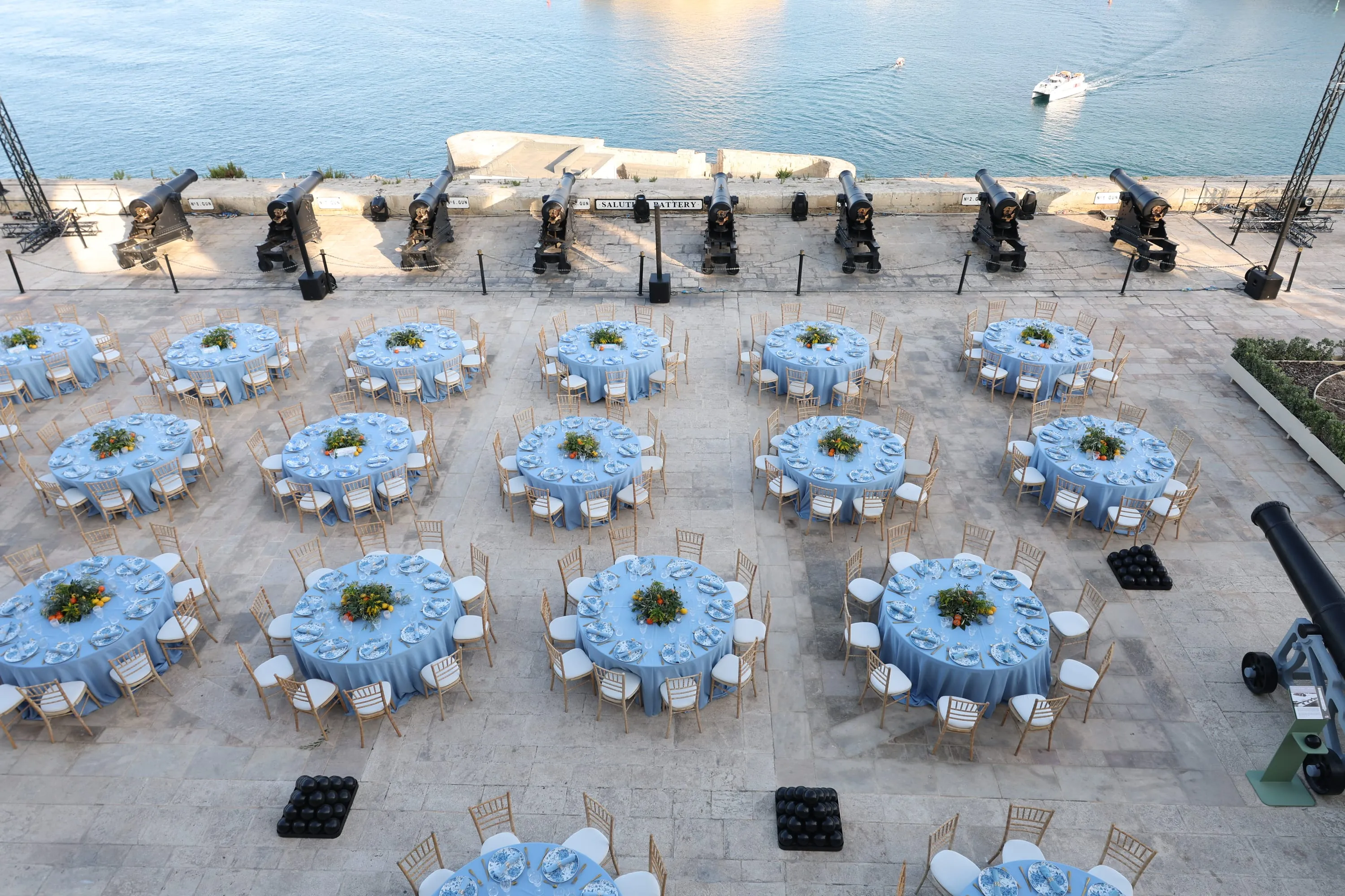 Dinner tables set among the cannons of the Saluting Battery above the Grand Harbour