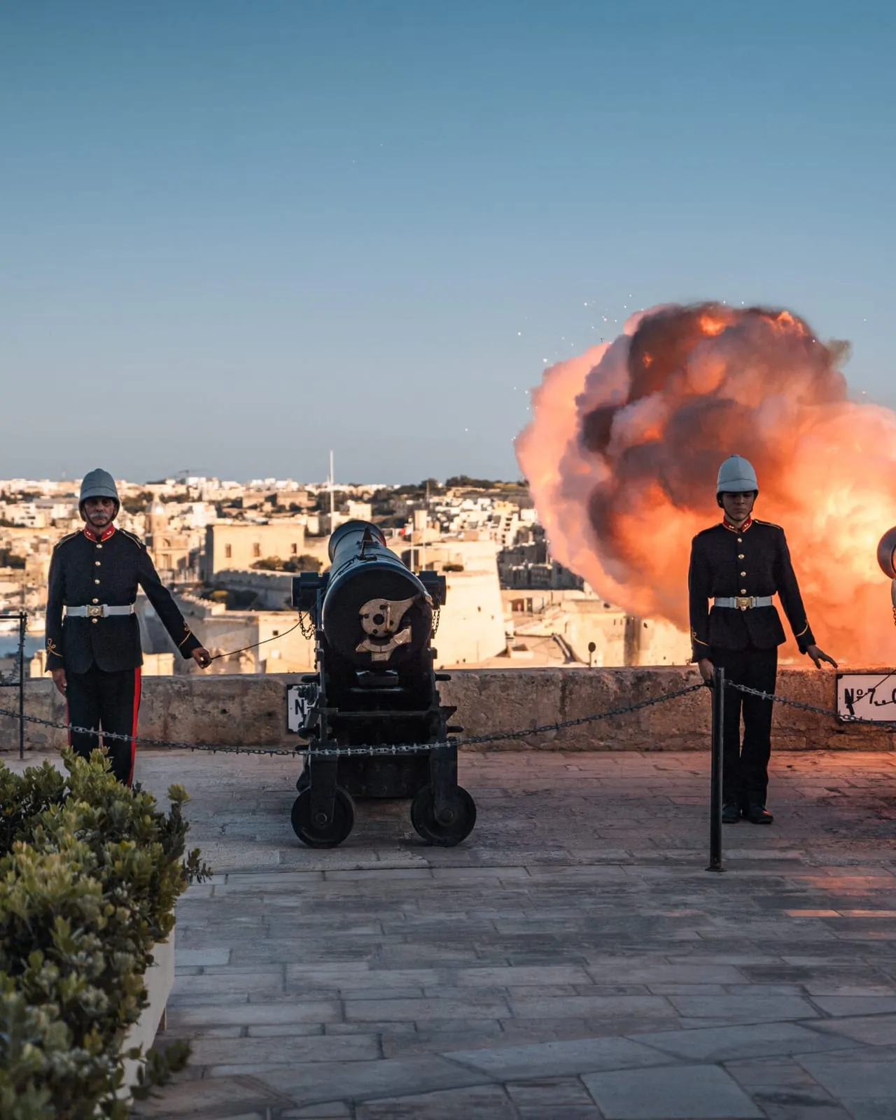 A gun of the Saluting Battery fired at dusk over the Grand Harbour
