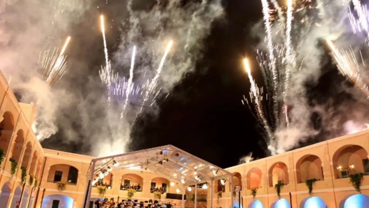 Fireworks over a clear marquee in the courtyard of Fort St Elmo