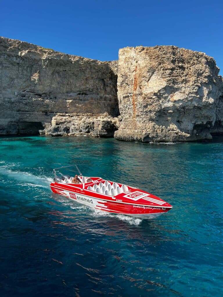 A power boat over the crystal blue seas of the Mediterranean.