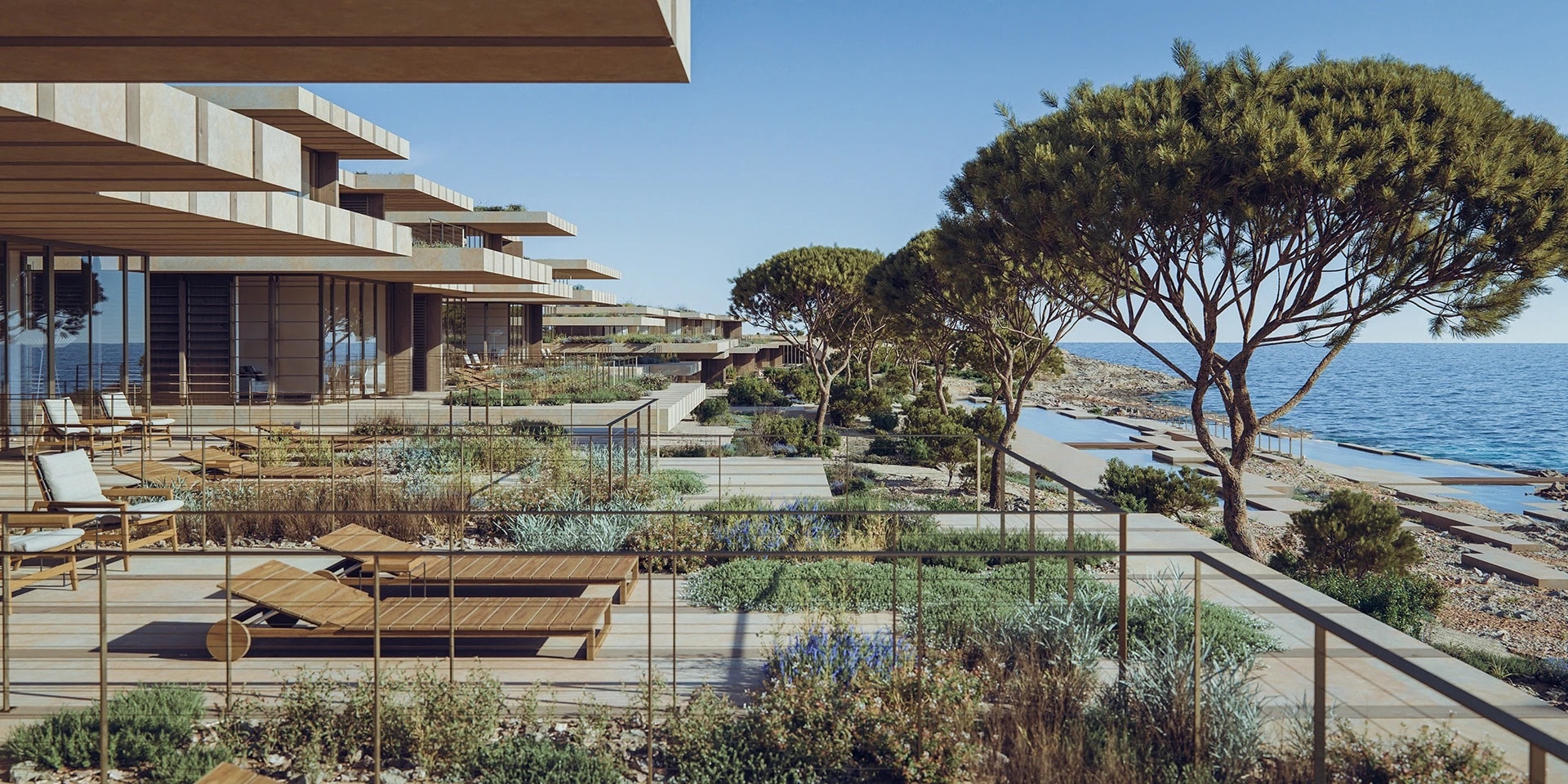 Exterior view of Six Senses Comino resort in Malta, showcasing modern low-rise suites, lush greenery, and expansive terraces with lounge chairs, all overlooking the pristine Mediterranean Sea.