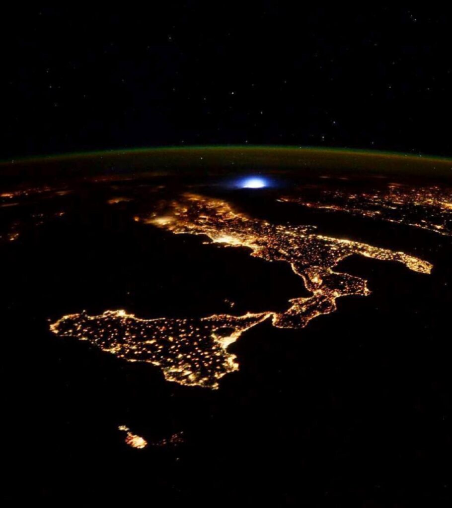 An aerial shot of Malta light up in the night's sky.