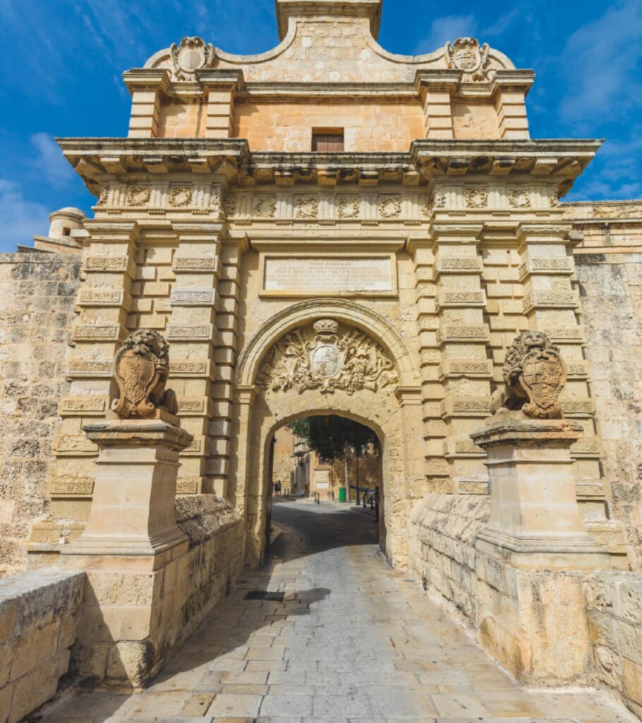 A picture of Imdina's wonderful and grand gate, adorned with many carvings into the Maltese limestone.