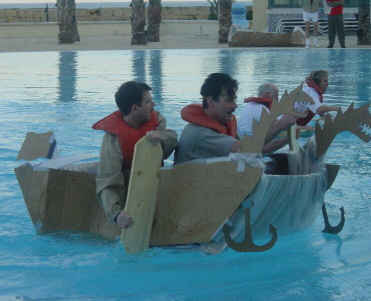 A team building activity where teammates make makeshift ships to cross a pool