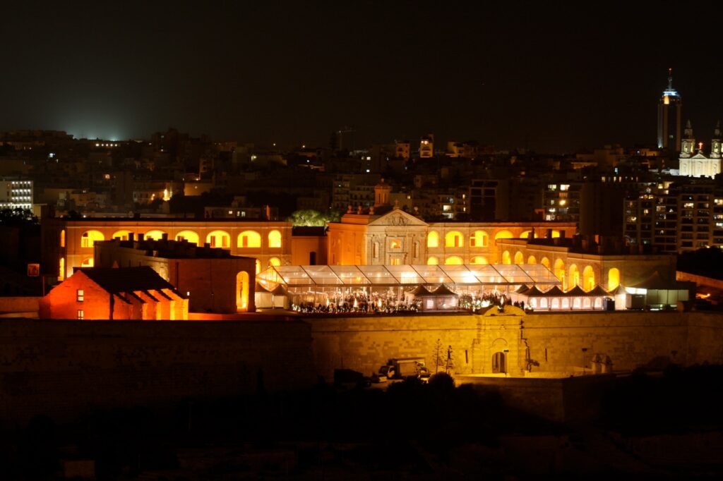 Fort Manoel in Malta at night, illuminated for an event. The fort is a significant historical and architectural landmark.