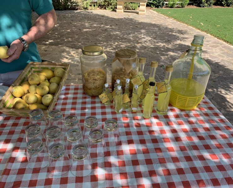 Homemade limoncello being poured for guests to try.